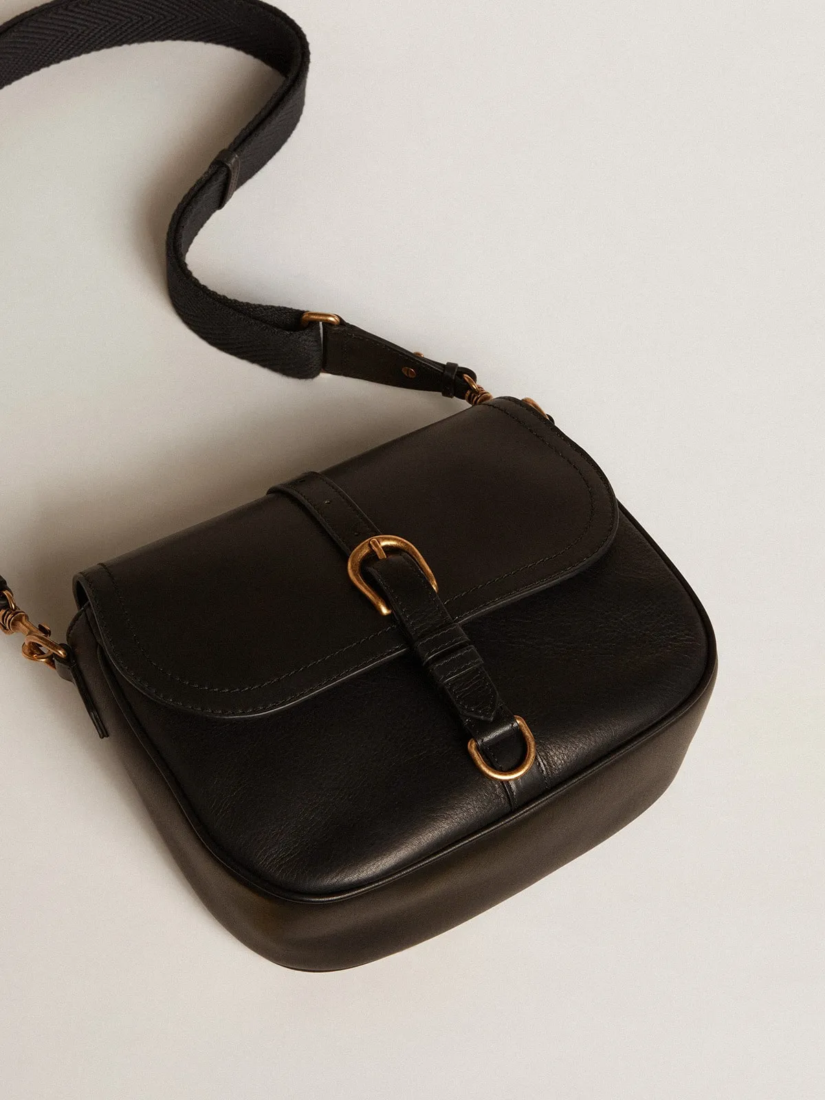 Medium Sally Bag in black leather with buckle and shoulder strap