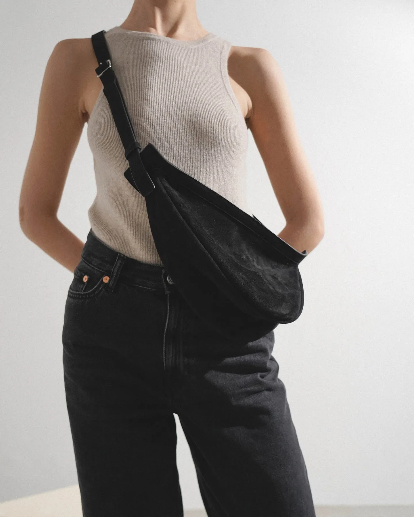 The Row Slouchy banana small black suede shoulder bag